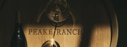 Peake Ranch wine barrel glass and bottle